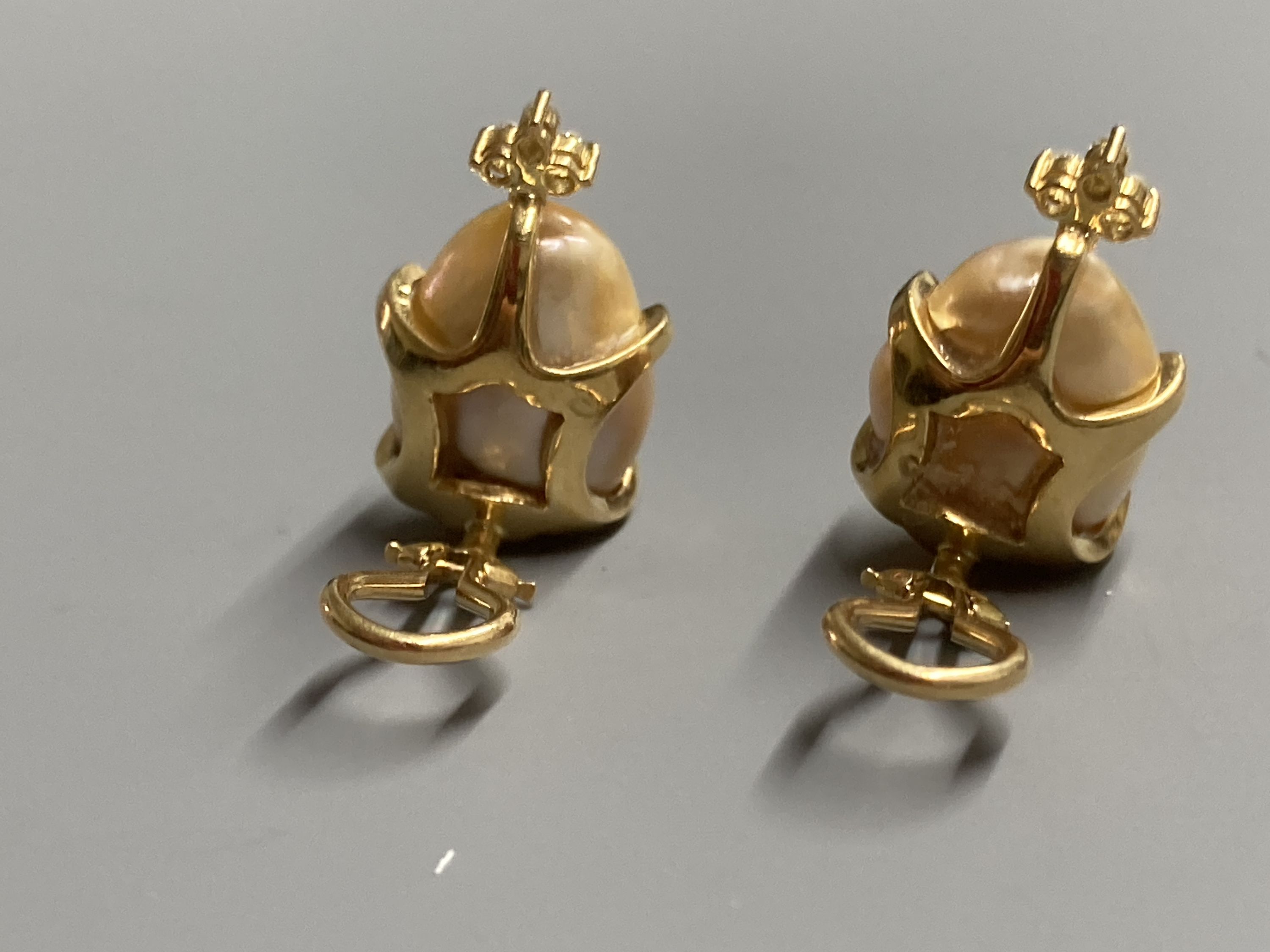 A modern pair of 18k yellow metal, baroque pearl and four stone diamond chip set ear clips, 21mm, gross 9.7 grams.